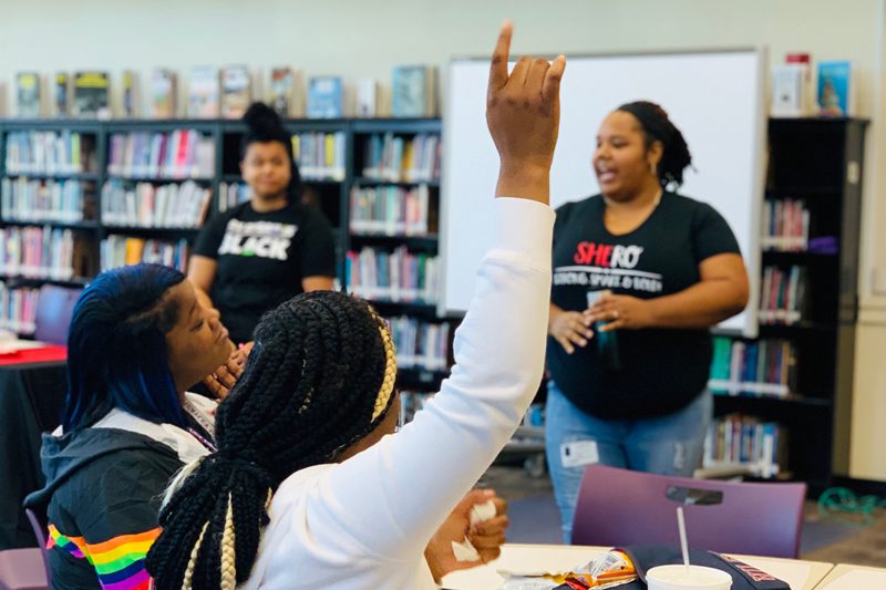 GIGH BoldLeadHERS raising hand